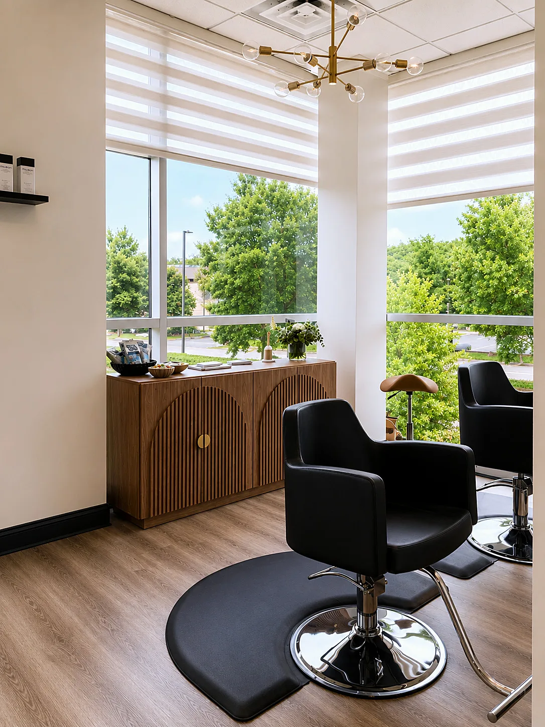 Styling station with black leather chair and walnut console